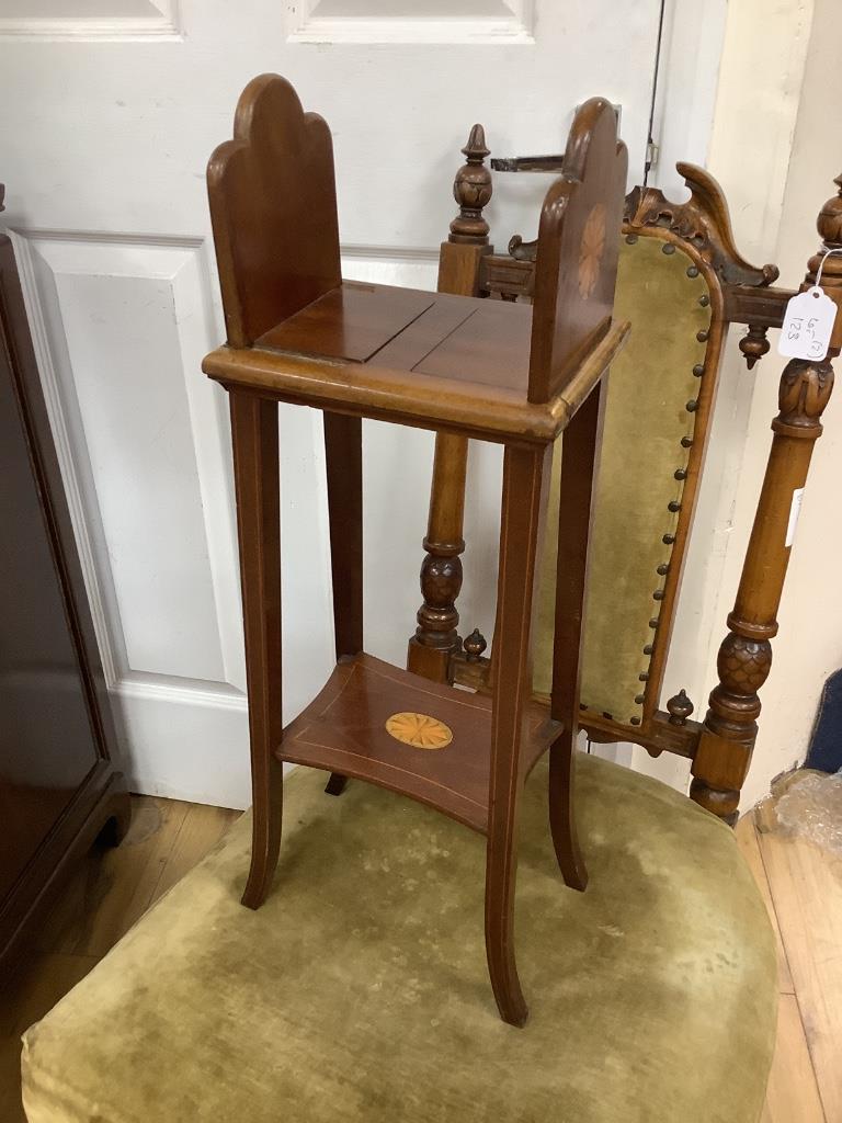 A Victorian nursing chair and an Edwardian book table